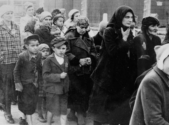 Jewish women and children from Subcarpathian Rus who have been selected for death at Auschwitz-Birkenau, walk toward the gas chambers. Credit: United States Holocaust Memorial Museum, courtesy of Yad Vashem (Public Domain)